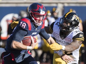 Montreal Alouettes quarterback Matthew Shiltz is tackled by Hamilton Tiger-Cats' Justin Tuggle during second-half CFL action in Montreal on Saturday, Oct. 25, 2019.