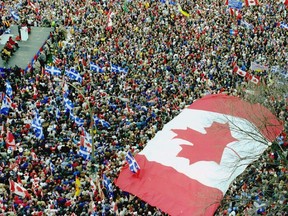 A huge Canadian flag marks a rally in support of Canadian unity in Montreal Oct. 27, 1995, three days before the 1995 Quebec referendum.