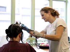 Wendy Shaffer-Berenbaum, a.k.a. Wendy the Lice Fairy, treats a client in Montreal on Wednesday, Oct. 30, 2019. (Allen McInnis / MONTREAL GAZETTE) ORG XMIT: 62384