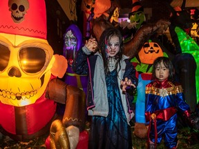 “No, I don’t really care,” about the rain, said Lara Park, 7, who enjoyed trick-or-treating with her sister Elise, 2, Thursday evening.