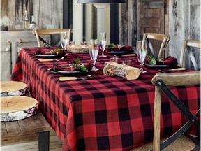 Rustic wood and classic "lumberjack style" checks create a cozy cottage setting in the dining room. Hunter Check Tablecloth, from $24, Simons.ca.