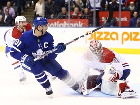 Carey Price #31 of the Montreal Canadiens makes a glove save on John Tavares #91 of the Toronto Maple Leafs in overtime during an NHL game at Scotiabank Arena on Oct. 5, 2019 in Toronto.