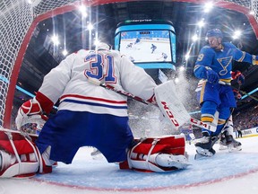 Canadiens goalie Carey Price makes a save against St. Louis Blues Vince Dunn during NHL game at the Enterprise Center in St. Louis on Oct. 19, 2019.