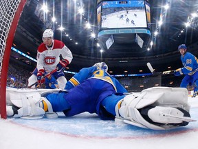 Canadiens rookie Nick Suzuki shoots the puck against Blues goalie Jake Allen at Enterprise Center in St. Louis on Sat., Oct. 19.