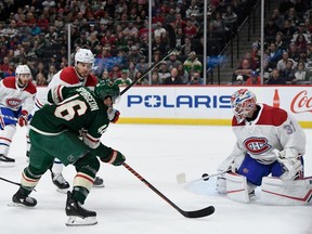 Canadiens goaltender Keith Kinkaid makes a stick save of the shot by Wild's Jared Spurgeon as Shea Weber helps to defend at Xcel Energy Center on Sunday, Oct.20, 2019, in St Paul, Minn.