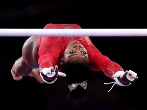 Simone Biles of United States competes in Women's Uneven Bars Final in the Apparatus Finals during Day 9 of 49th FIG Artistic Gymnastics World Championships at Hanns-Martin-Schleyer-Halle on Saturday, Oct. 12, 2019, in Stuttgart, Germany.