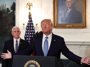 President Donald Trump with Vice-President Mike Pence in the Diplomatic Room at the White House Oct. 23, 2019.