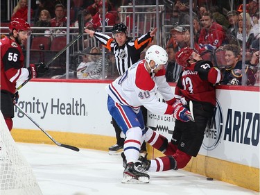 Joel Armia #40 of the Montreal Canadiens checks Oliver Ekman-Larsson #23 of the Arizona Coyotes during the first period.