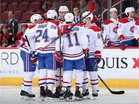 Shea Weber #6 of the Montreal Canadiens celebrates with Phillip Danault #24, Brendan Gallagher #11 and Tomas Tatar #90 after scoring against the Arizona Coyotes during the second period of the NHL game at Gila River Arena on October 30, 2019 in Glendale, Arizona.