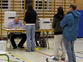 Voters line up to vote in the federal election at École Lanaudière in Montreal May 2, 2011.