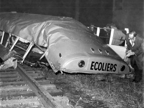 Photo from Dorion bus-train crash of Oct. 7, 1966. Oct. 8, 1966 caption: Force of crash sheared school bus in half, carried part of it far along the tracks.