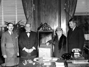 Original caption: Mayor sends clothing to Europe: Making their contribution to the National Clothing Collection for relief of the liberated peoples of Europe are Mayor Camillien Houde and Mrs. Houde, flanked on the left by Councillor Jean Morin, co-chairman of the Greater Montreal collection and on the right by Lionel E. Brittle. The mayor has asked all citizens to give whatever they can and to make certain that clothing parcels are well and securely wrapped."