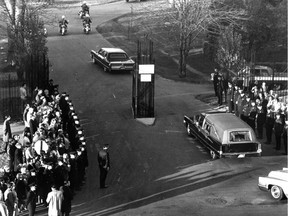 A hearse carrying the body of Pierre Laporte enters Côte-des-Neiges Cemetery on Oct. 20, 1970. Laporte, a Quebec cabinet minister, was killed after being kidnapped by the Front de libération de Québec.
