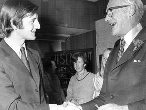 Defeated Progressive Conservative candidate Michael Meighen (left) concedes to Charles "Bud" Drury of the Liberals in Westmount riding on Oct. 30, 1972. This photo was published the following day.