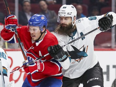 San Jose Sharks Brent Burns hooks Montreal Canadiens Brendan Gallagher during third period of National Hockey League game in Montreal Thursday October 24, 2019. (John Mahoney / MONTREAL GAZETTE)