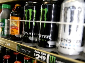 Cans of Monster Energy Drink are displayed at a store.