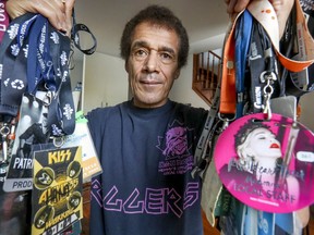 Stage technician Bienné Blémur with some of the backstage passes he has accumulated during his career as a rigger, in his home in Montreal Wednesday October 9, 2019.  He has been off work for three years after a co-worker called him a racial slur resulting in a battle with the union that controls the work in the city.