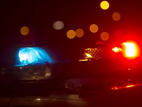 Red and blue light flashing atop a police car