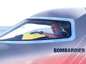 Bruce Best cleans the cockpit inside the mockup of Bombardier's Learjet Liberty 75 at the National Business Aviation Association (NBAA) exhibition in Las Vegas Oct. 21, 2019.