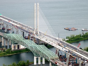 Aerial image of the new Champlain Bridge in Montreal next to the old Champlain Bridge (R) on June 21, 2019.