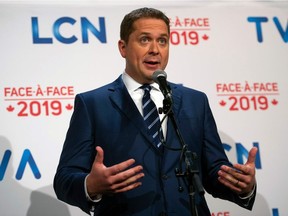 Leader of the Conservative Party of Canada Andrew Scheer addresses the press after the French debate for the 2019 federal election, the "Face-a-Face 2019" presented in the TVA studios, in Montreal, Quebec, Canada, on October 2, 2019. - Prime Minister Justin Trudeau will appear for his first debate of the 2019 election on October 2, facing off against main rival Andrew Scheer of the Conservative Party just three weeks ahead of the knife-edge vote. They will spar in French, looking to sway votes in the key battleground of Quebec, where one quarter of the 338 seats in parliament are up for grabs. (Photo by Sebastien ST-JEAN / AFP)