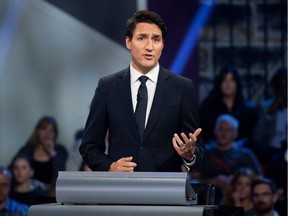 Canadian Prime Minister and Liberal leader Justin Trudeau responds to a question during the Federal Leaders Debate in Gatineau, Quebec on October 7, 2019. (Photo by Sean KILPATRICK / POOL / AFP)
