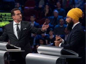 Bloc Quebecois leader Yves-Francois Blanchet (L) and NDP leader Jagmeet Singh debate a point  during the Federal Leaders Debate at the Canadian Museum of History in Gatineau, Quebec on October 7, 2019. (Photo by Justin Tang / POOL / AFP)