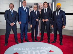 Bloc Quebecois leader Yves-François Blanchet, Conservative leader Andrew Scheer, TVA network host Pierre Bruneau, Liberal leader and Prime Minister Justin Trudeau and NDP leader Jagmeet Singh pose before a French language debate for the 2019 federal election at TVA studios in Montreal, Quebec, Canada October 2, 2019.