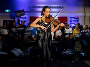 A fidler performs before the leader of Canada's Conservatives, Andrew Scheer, campaigns for the coming election in Little Harbour, N.S., on Thursday, Oct. 17, 2019.