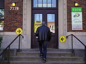 A man enters a polling place to cast his ballot for today's election in Montreal, Quebec, Canada, October 21, 2019. REUTERS/Carlo Allegri