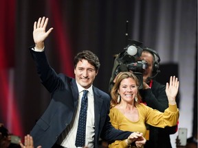 Liberal leader and Canadian Prime Minister Justin Trudeau and his wife Sophie Gregoire Trudeau wave to supporters after the federal election at the Palais des Congres in Montreal, Quebec, Canada October 22, 2019. REUTERS/Carlo Allegri     TPX IMAGES OF THE DAY