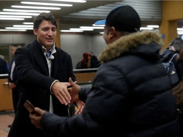 Canadian Prime Minister Justin Trudeau greets commuters in a metro in Montreal, Quebec, Canada October 22, 2019. REUTERS/Stephane Mahe