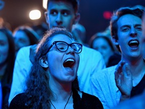 Fans react to the positive results at the election party of Bloc Québécois Leader Yves-François Blanchet Monday night. The Bloc ended up with 32 seats, up from 10.