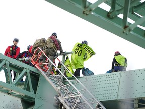 Extinction Rebellion activists on the Jacques Cartier Bridge in Montreal on Oct. 8, 2019.