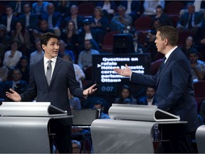 Liberal leader Justin Trudeau, left, and Conservative leader Andrew Scheer take part in the the Federal leaders French language debate in Gatineau, Que. on Thursday, October 10, 2019.