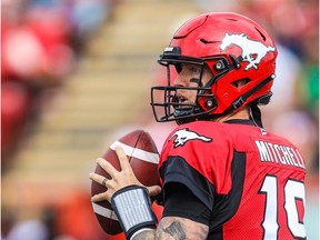 Calgary Stampeders quarterback Bo Levi Mitchell (19) drops back to pass against the Hamilton Tiger-Cats in the first half during a Canadian Football League game at McMahon Stadium.