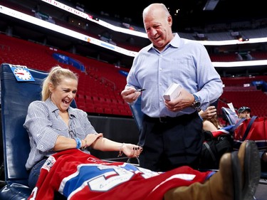 Head coach Claude Julien is seen with Renée Richard during the annual Montreal Canadiens' blood drive at the Bell Centre on Wednesday, Oct. 23, 2019.