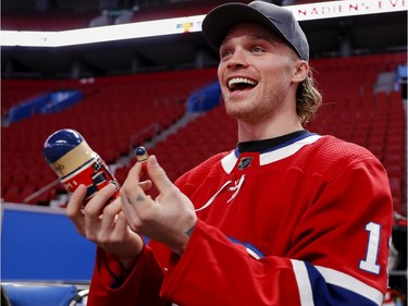 Max Domi reacts to being asked to sign some Russian dolls painted in the Canadiens colours during the annual Montreal Canadiens' blood drive at the Bell Centre on Wednesday, Oct. 23, 2019.