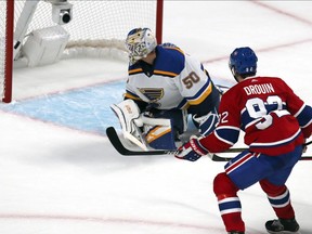 The Canadiens' Jonathan Drouin scores on St. Louis Blues goaltender Jordan Bennington during first period of NHL game at the Bell Centre in Montreal on Oct. 12, 2019.