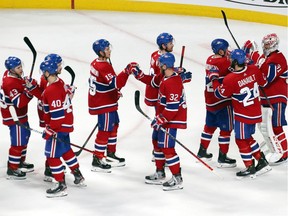 Montreal Canadiens players celebrate after their win against St. Louis Blues at Bell Centre.