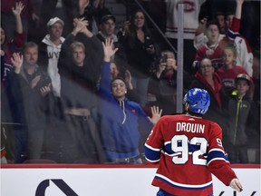 The Canadiens’ Jonathan Drouin throws puck to fans at Bell Centre after scoring two goals and being named the first star of a 5-2 win over the Toronto Maple Leafs in NHL action at the Bell Centre in Montreal on Oct. 26, 2019.