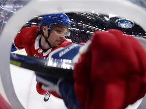 The Canadiens' Max Domi gets checked into the boards during second period of NHL game against the Toronto Maple Leafs at the Bell Centre in Montreal on Oct. 26, 2019.