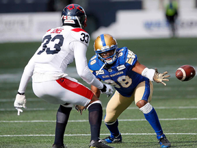 Blue Bombers' Rasheed Bailey (88) can't hang onto the pass as Montreal Alouettes' Jarnor Jones defends during the first half of CFL action in Winnipeg on Saturday, Oct. 12, 2019.