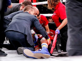 Patrick Day is tended to by paramedics after being knocked out by Charles Conwell during a USBA Super-Welterweight boxing match at Wintrust Arena in Chicago on Oct. 12, 2019.