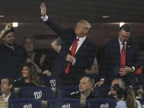 President Donald Trump waves to the crowd during Game 5 of the World Series between the Washington Nationals and the Houston Astros at Nationals Park in Washington on Sunday, Oct. 27, 2019. MUST CREDIT: Washington Post photo by Toni L. Sandys.