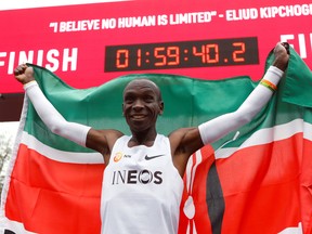 Kenya's Eliud Kipchoge, the marathon world record holder, celebrates after a successful attempt to run a marathon in under two hours in Vienna, Austria, October 12, 2019.