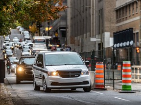 Traffic has been narrowed top one lane on Rue de la Cathedrale south of St-Jacques in Montreal on Friday, Oct. 18, 2019.