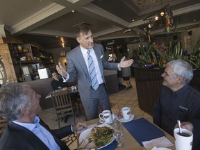 Maxime Bernier, leader of the PPC, speaks with people in a restaurant in Ste-Marie-de-Beauce, south of Quebec city, on Oct. 15, 2019