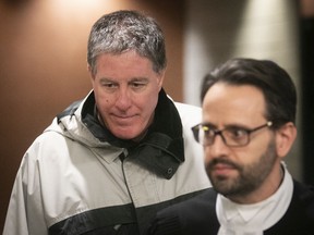 Father Brian Boucher, left, arrives at Palais de Justice with his lawyer James Cocciardi for sentencing in January 2019. He was found guilty of sexual assault of a minor.