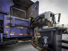 A garbage bin is picked up by a Services Matrec  truck in Beaconsfield.